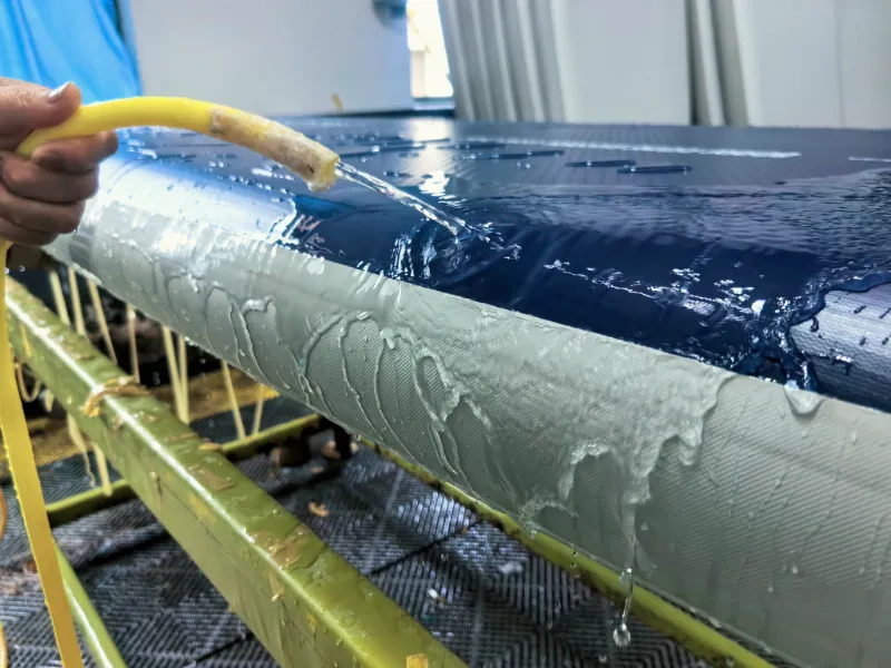 A fully inflated packraft undergoing a 24-hour quality control leak test in the inflatable boat manufacturer