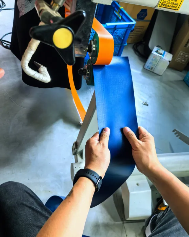Close-up of a high-frequency heat-welded seam on an inflatable packraft, ensuring an airtight and durable bond.